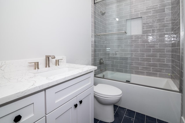 full bath featuring toilet, vanity, shower / bathing tub combination, and tile patterned flooring
