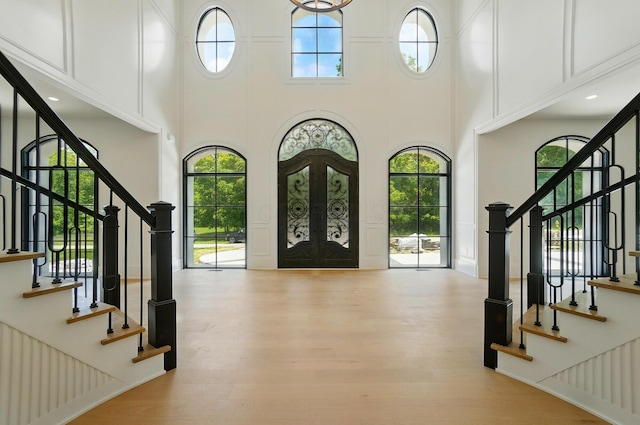 10007 Allen Dr, Dublin, OH 43017 - entryway with a high ceiling, stairs, and wood finished floors