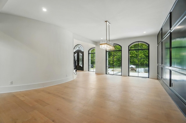 10007 Allen Dr, Dublin, OH 43017 - empty room with light wood-style floors, recessed lighting, a chandelier, and baseboards