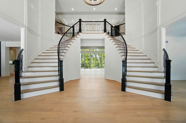 10007 Allen Dr, Dublin, OH 43017 - stairway featuring wood finished floors, a towering ceiling, and recessed lighting