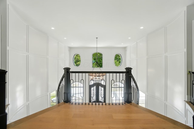 10007 Allen Dr, Dublin, OH 43017 - corridor featuring a decorative wall and an upstairs landing