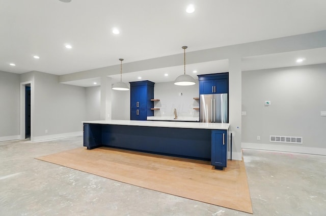 10007 Allen Dr, Dublin, OH 43017 - kitchen with stainless steel fridge, blue cabinets, concrete floors, open shelves, and light countertops