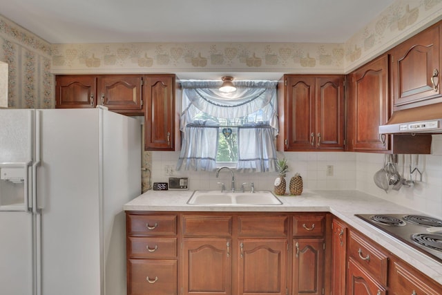 6693 Red Coach Ln, Reynoldsburg, OH 43068 - kitchen with stainless steel electric cooktop, decorative backsplash, white fridge with ice dispenser, light countertops, and a sink