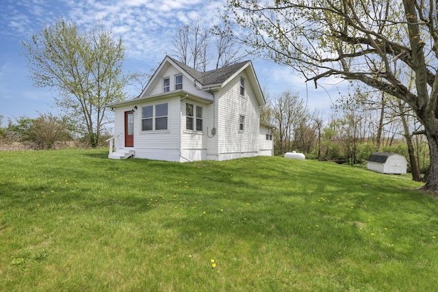 8400 16th Rd Unit Sw, Amanda, OH 43102 - view of side of home with entry steps, a lawn, an outbuilding, and a storage shed