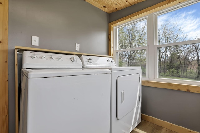 8400 16th Rd Unit Sw, Amanda, OH 43102 - clothes washing area featuring separate washer and dryer, baseboards, wood finished floors, and laundry area
