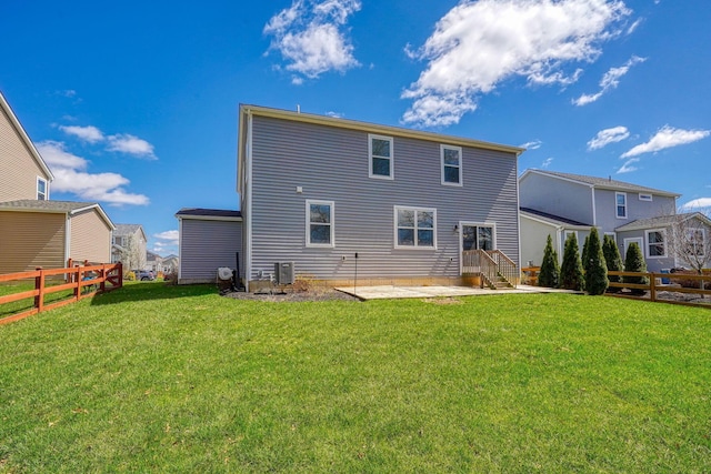 rear view of house with cooling unit, a fenced backyard, a patio area, and a lawn