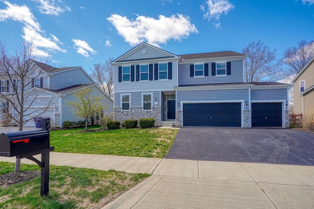 view of front of property featuring a garage, aphalt driveway, stone siding, and a front yard