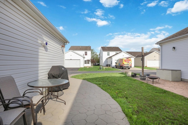 view of patio / terrace with a grill and a residential view