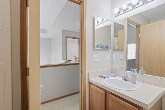 bathroom featuring vanity and baseboards