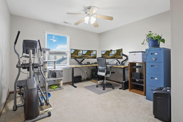 carpeted office featuring ceiling fan, baseboards, and visible vents