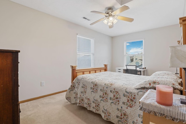bedroom with visible vents, baseboards, multiple windows, and carpet floors