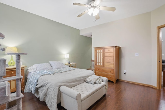 bedroom featuring baseboards, ceiling fan, and wood finished floors