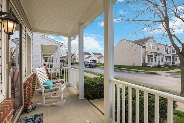 balcony with a residential view and covered porch