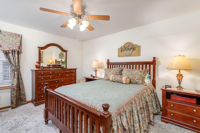 bedroom with baseboards, a ceiling fan, and carpet flooring