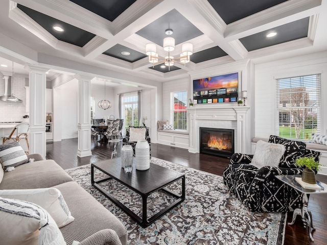 7251 Wilton Chase St, Dublin, OH 43017 - living room with beam ceiling, a notable chandelier, and dark wood-style floors
