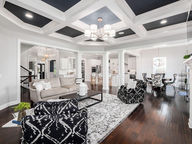 7251 Wilton Chase St, Dublin, OH 43017 - living area featuring a notable chandelier, dark wood-style floors, beam ceiling, ornate columns, and stairs