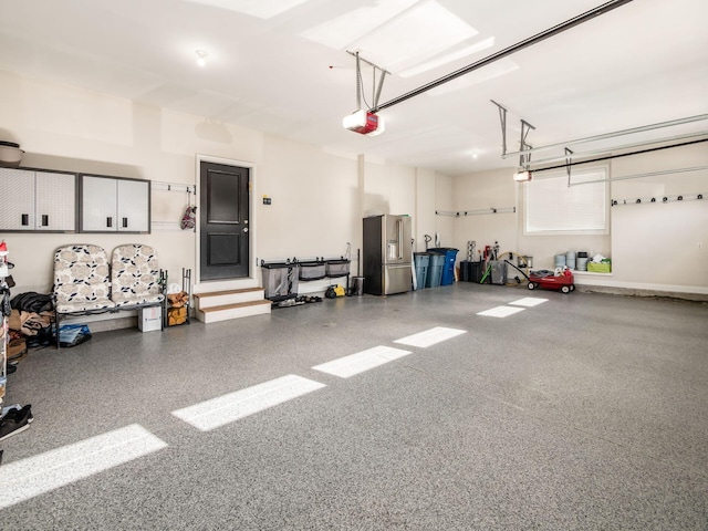 7251 Wilton Chase St, Dublin, OH 43017 - garage with high quality fridge and a garage door opener