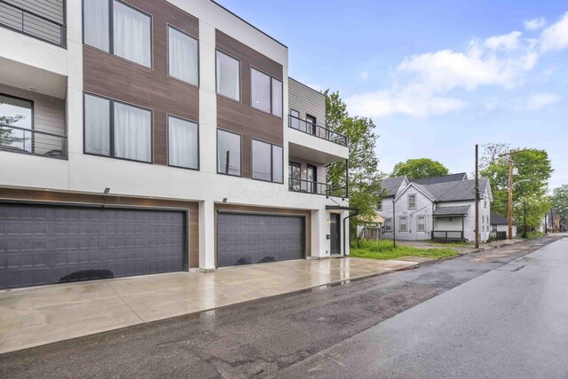 362-366 Zimpfer St Unit 1-3, Columbus, OH 43206 - view of building exterior with driveway and a garage
