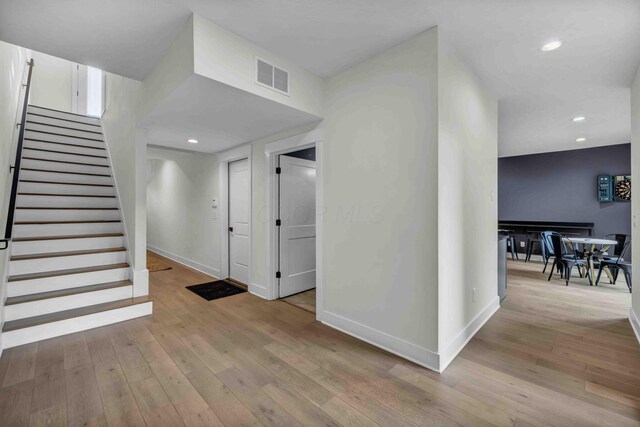 362-366 Zimpfer St Unit 1-3, Columbus, OH 43206 - foyer featuring baseboards, wood-type flooring, stairway, and recessed lighting