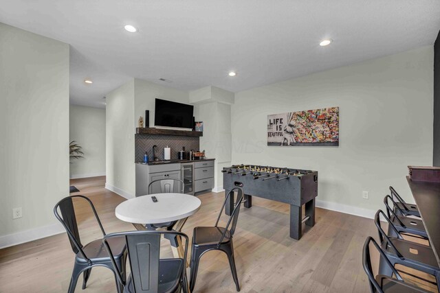 362-366 Zimpfer St Unit 1-3, Columbus, OH 43206 - dining area featuring bar with sink, baseboards, beverage cooler, wood finished floors, and recessed lighting