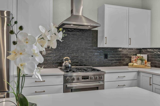 362-366 Zimpfer St Unit 1-3, Columbus, OH 43206 - kitchen featuring wall chimney exhaust hood, stainless steel range with gas stovetop, light countertops, and backsplash
