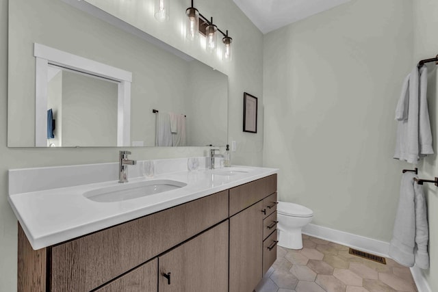 362-366 Zimpfer St Unit 1-3, Columbus, OH 43206 - full bathroom with double vanity, toilet, and baseboards