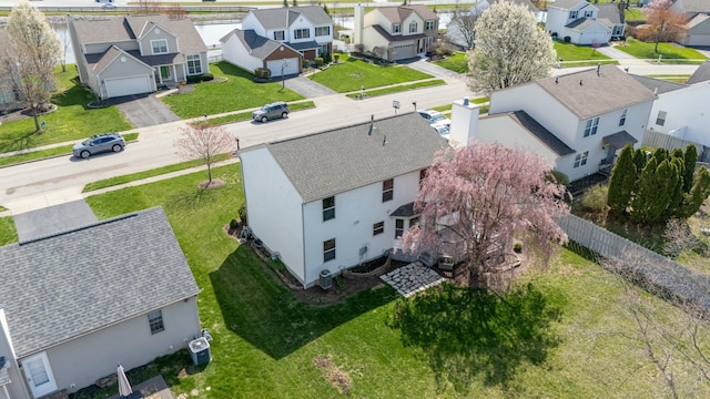 birds eye view of property with a residential view
