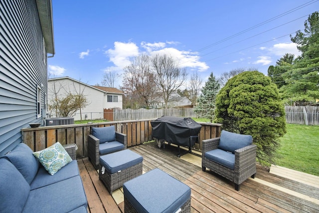 wooden terrace with area for grilling, a fenced backyard, and outdoor lounge area
