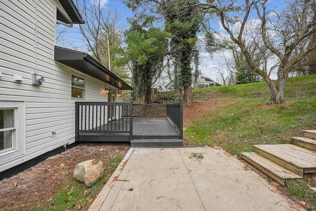 view of yard featuring a patio area and a deck