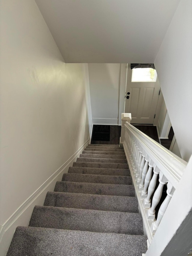 stairway with baseboards
