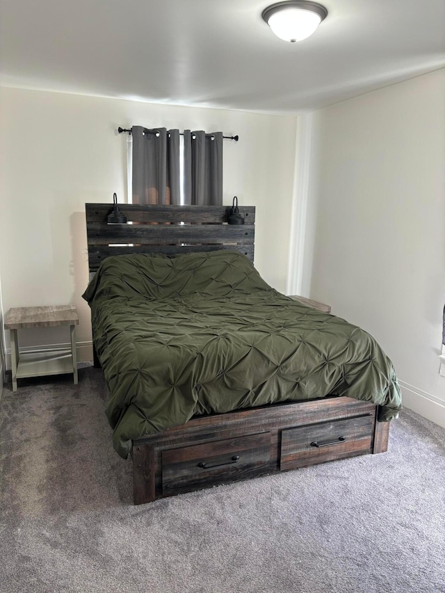 carpeted bedroom with baseboards