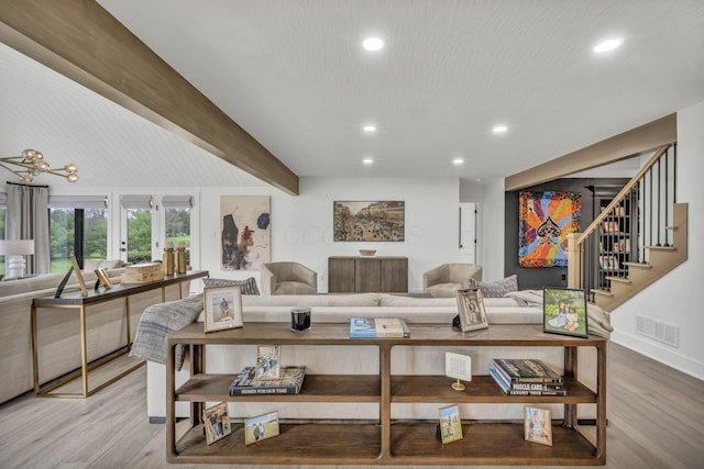 living room with recessed lighting, light wood finished floors, visible vents, and stairway