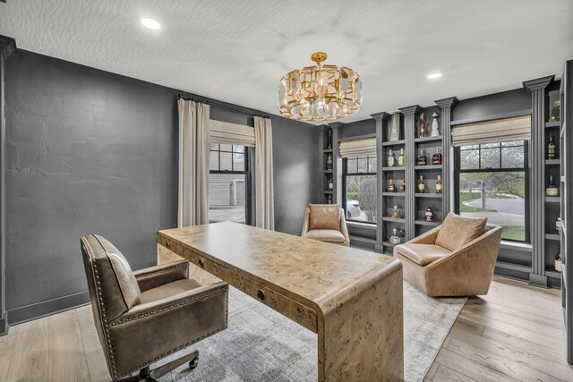 office featuring a chandelier, recessed lighting, and light wood-style floors