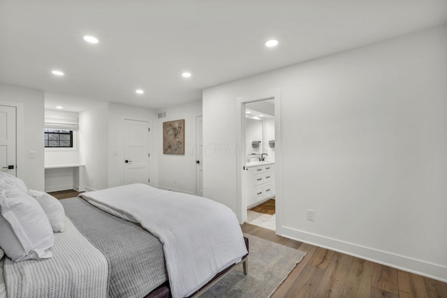 bedroom featuring baseboards, recessed lighting, wood finished floors, and visible vents