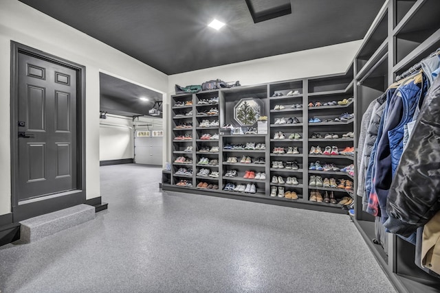 walk in closet with a barn door