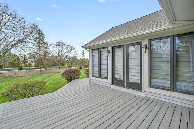 wooden terrace with fence and a yard