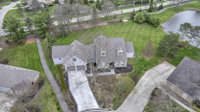 birds eye view of property featuring a water view