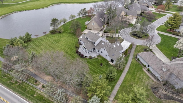 drone / aerial view featuring a residential view and a water view