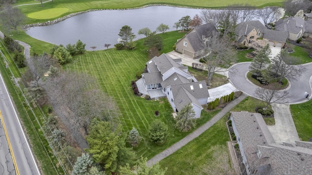 aerial view featuring golf course view, a residential view, and a water view