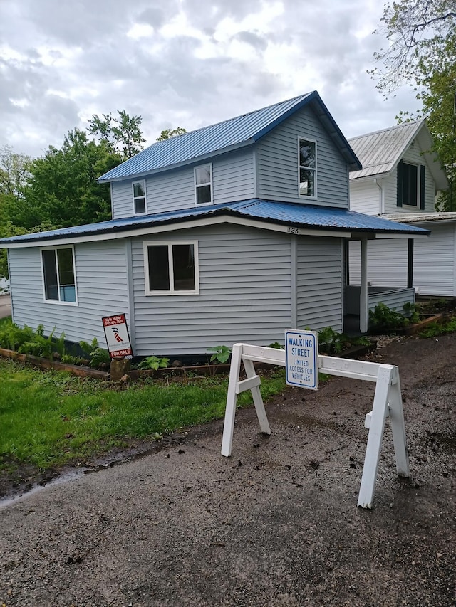 126 7th St, Lancaster, OH 43130 - view of side of property with metal roof
