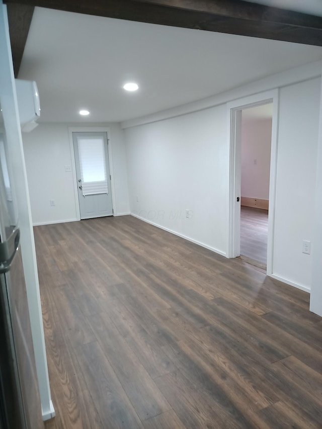 126 7th St, Lancaster, OH 43130 - below grade area featuring dark wood-style floors, recessed lighting, freestanding refrigerator, and baseboards