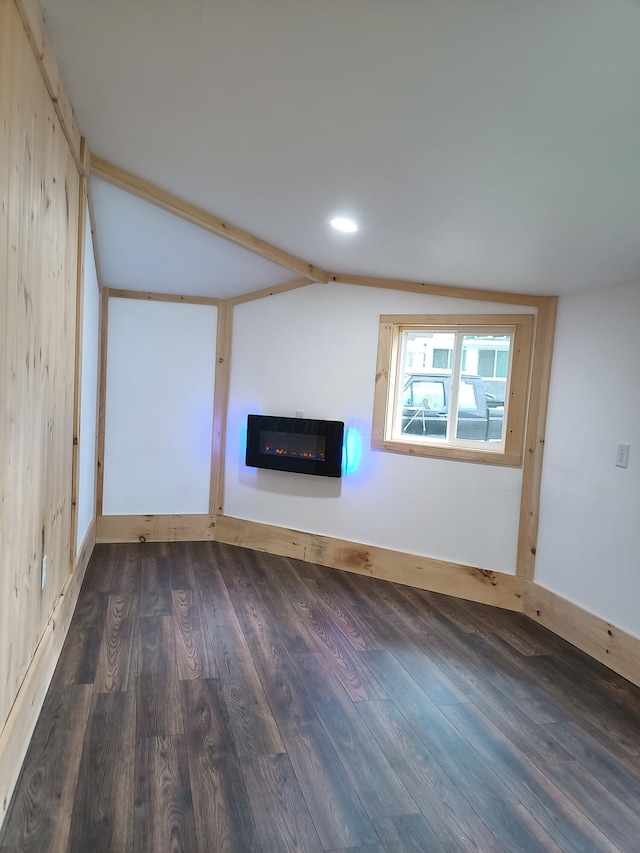 126 7th St, Lancaster, OH 43130 - unfurnished living room with a glass covered fireplace, wood finished floors, vaulted ceiling, heating unit, and recessed lighting