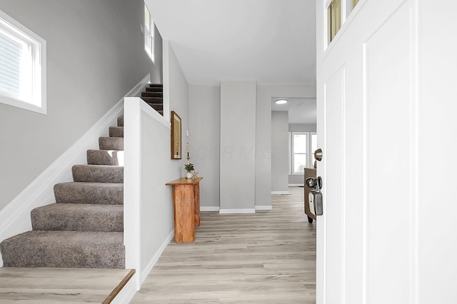 interior space featuring wood finished floors and baseboards