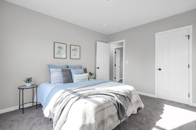 bedroom with carpet flooring and baseboards