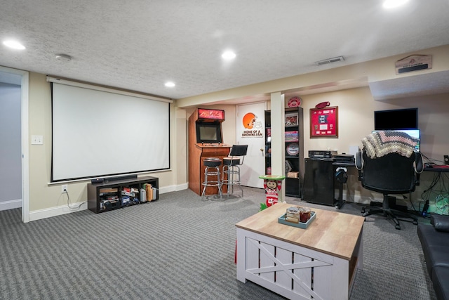 cinema featuring visible vents, baseboards, carpet, a textured ceiling, and recessed lighting
