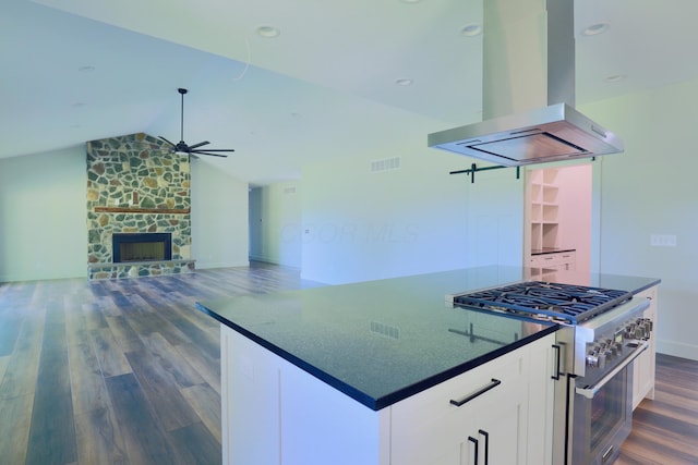 3597 Country Club Rd SW, Lancaster, OH 43130 - kitchen featuring island range hood, high end stainless steel range, dark countertops, a ceiling fan, and dark wood-style floors