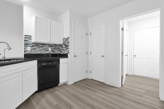 4899 Common Market Pl, Dublin, OH 43016 - kitchen with dishwasher, dark countertops, light wood-style floors, and white cabinets