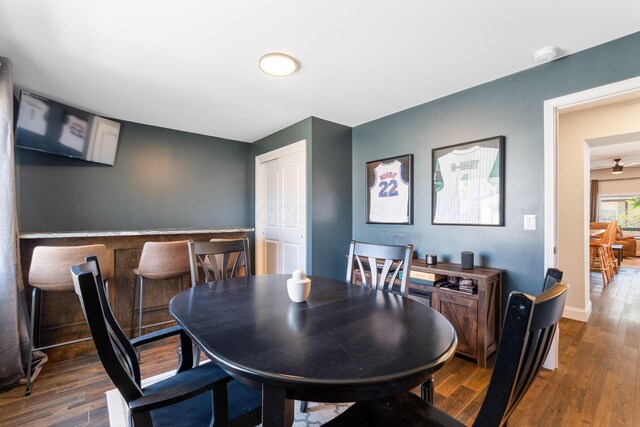 dining room featuring wood finished floors and baseboards