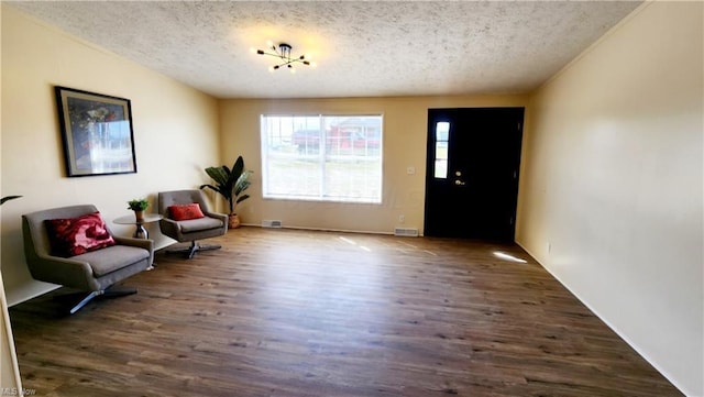 6243 Branch Cir, Zanesville, OH 43701 - living area featuring visible vents, wood finished floors, and a textured ceiling
