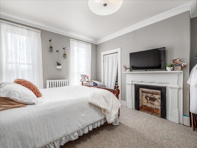 bedroom featuring crown molding, a fireplace with flush hearth, carpet floors, and radiator